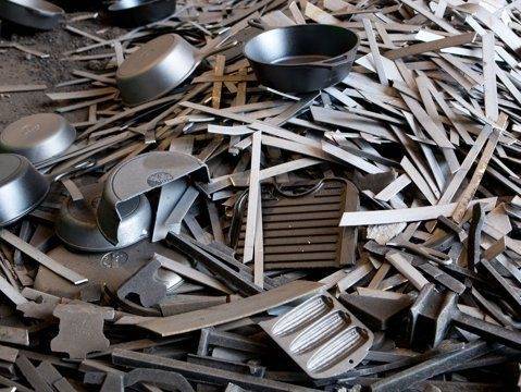 Pile of cut aluminum extrusions and sheet.