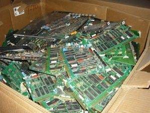 Box of green circuit boards.